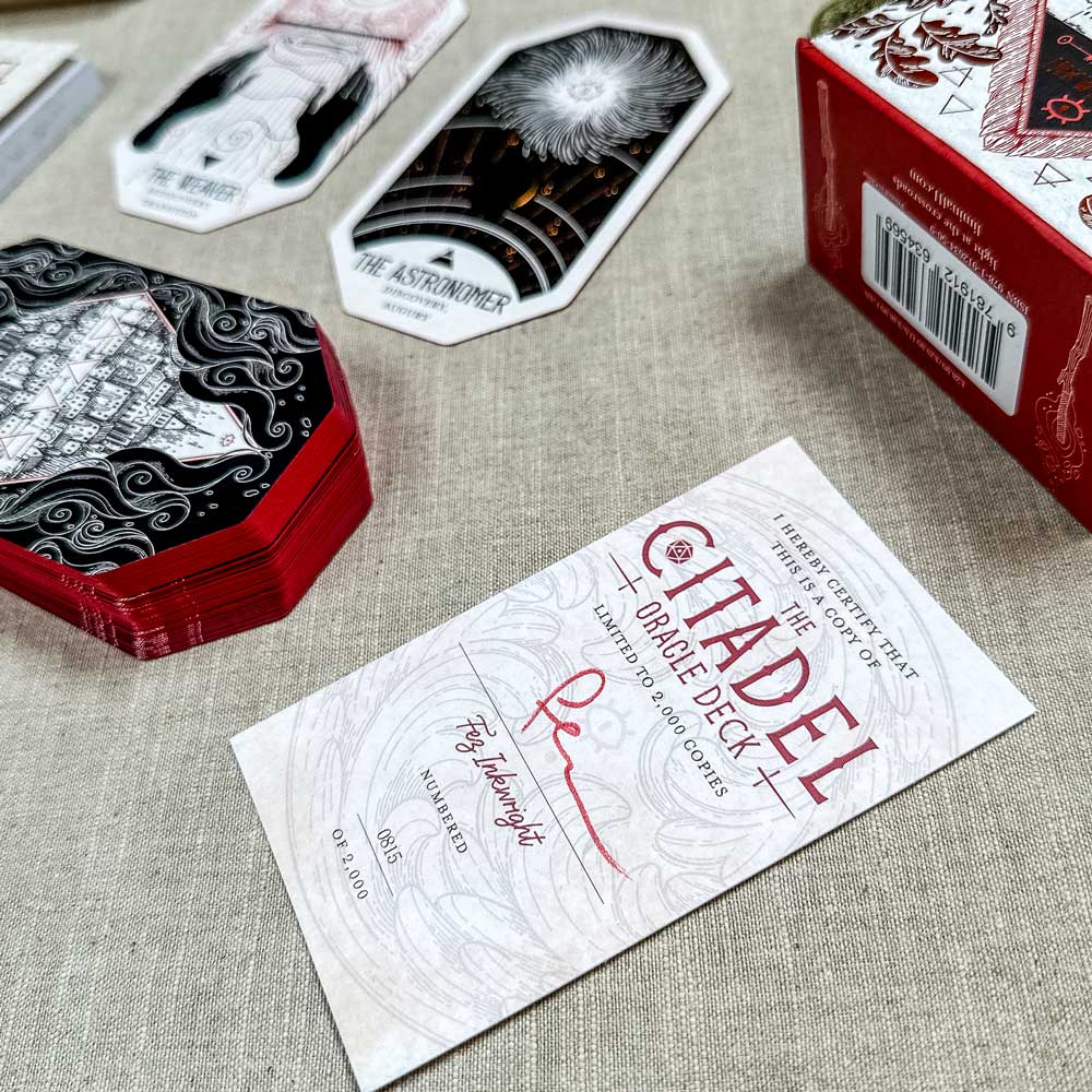 The Citadel Oracle - LE Boxed Set includes a stunning black and white oracle deck in a striking red box, featuring Fez Inkwright's art like "The Astronomer" with detailed illustrations.
