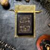 The "Madam Lydia Wilhelmina's Tarot" deck is elegantly displayed on a golden pouch surrounded by moss, a candle, and decorative items, perfectly capturing the mystical ambiance the tarot is renowned for.