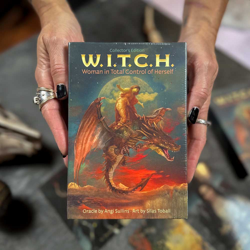 A person holds a boxed set titled "W.I.T.C.H." The cover features mystical themes, including a witch riding a dragon. Credits: Oracle by Angi Sullins and art by Silas Toball.